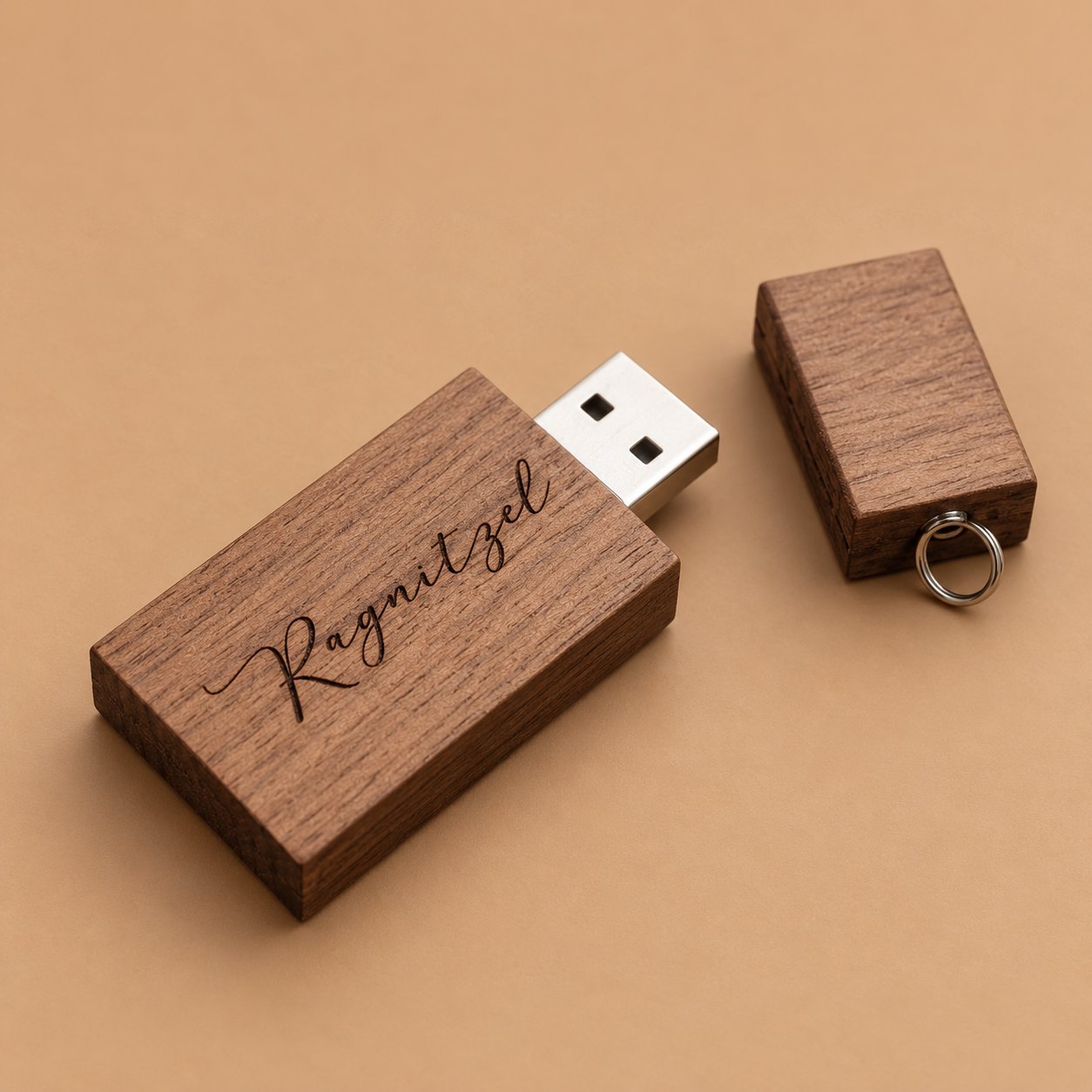 Walnut rectangular wooden USB drive engraved with the single personal name Ragnitzel in flowing script, illustrating how an individual name looks when burned into dark wood.