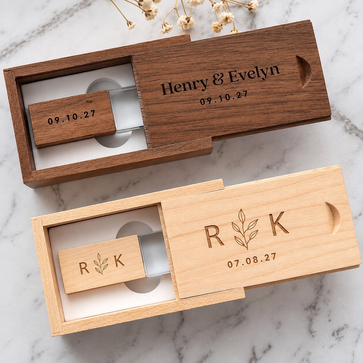 Two sliding-lid wooden USB presentation boxes in walnut and maple finish, engraved with wedding date and monogram, showing secure closure style suitable for bulk event-favor orders.