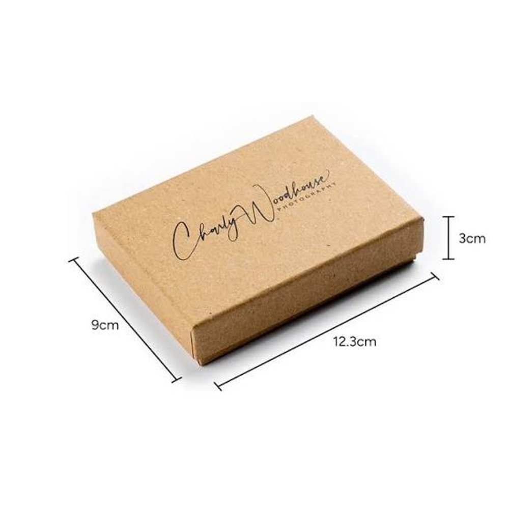 Kraft paper photo box with dimension arrows showing 12.3 cm wide, 9 cm deep and 3 cm tall, branded for a photographer.