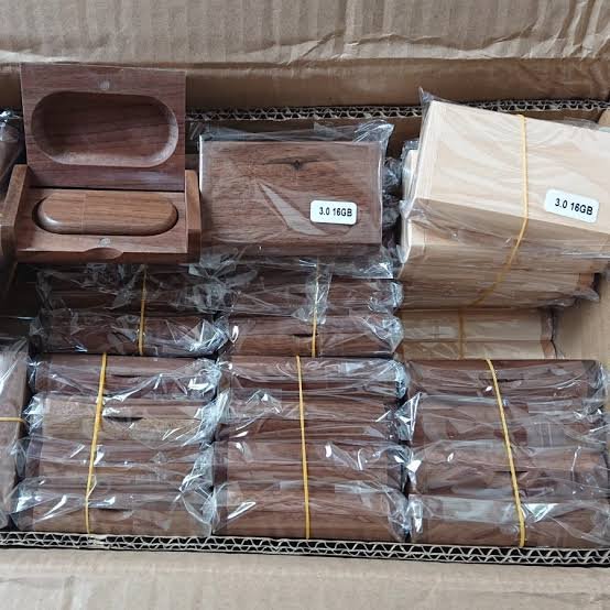 Packed wooden USB drives and boxes sorted inside a shipping carton