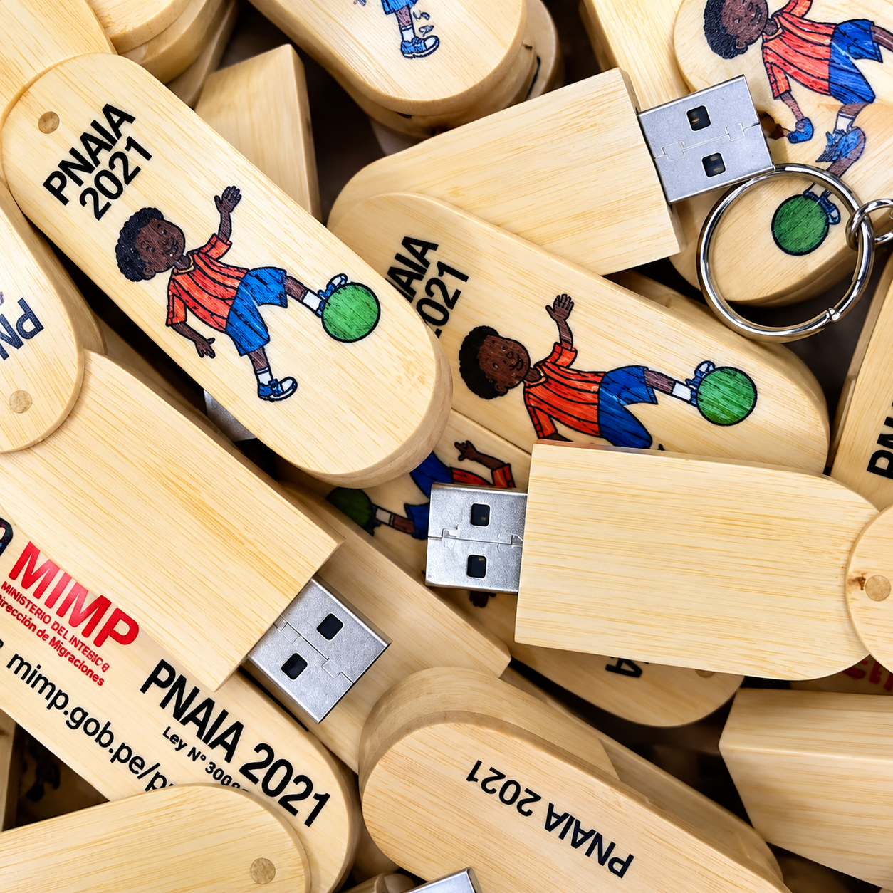Printed bamboo USB drives prepared for event distribution