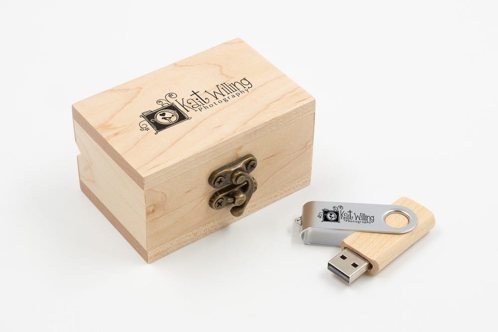 Swivel wooden USB flash drive with its cover closed, stored in a wooden gift box