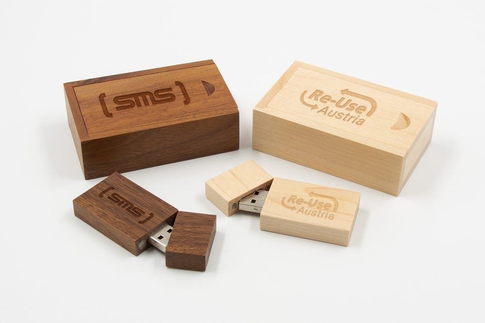 Walnut and maple wooden USB flash drive slide boxes showing two natural wood finishes
