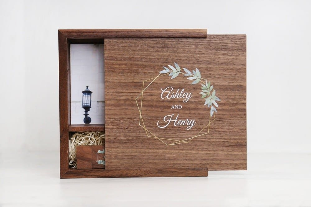 Walnut wooden USB box with a photo print and soft filler protecting the drive inside