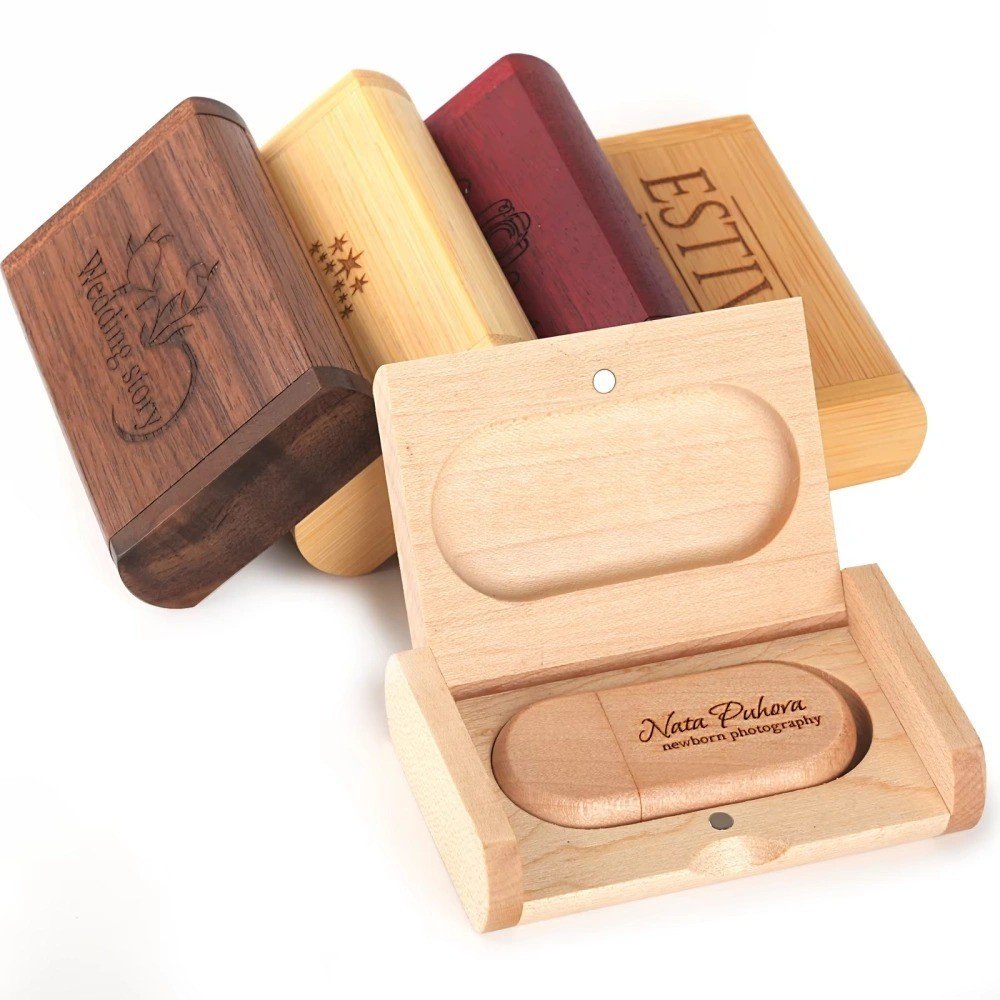 Wooden USB drives with an open presentation box and engraved branding